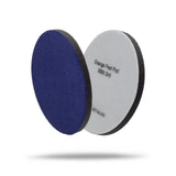 Two circular orange peel sanding discs for automotive detailing, one showing the textured purple velvet side and the other showing the light gray backing with black text reading 'Orange Peel Pad 3000 Grit'. 2072080P Orange Peel Pads - 3000 Grit Velvet 3in (2 Pack)