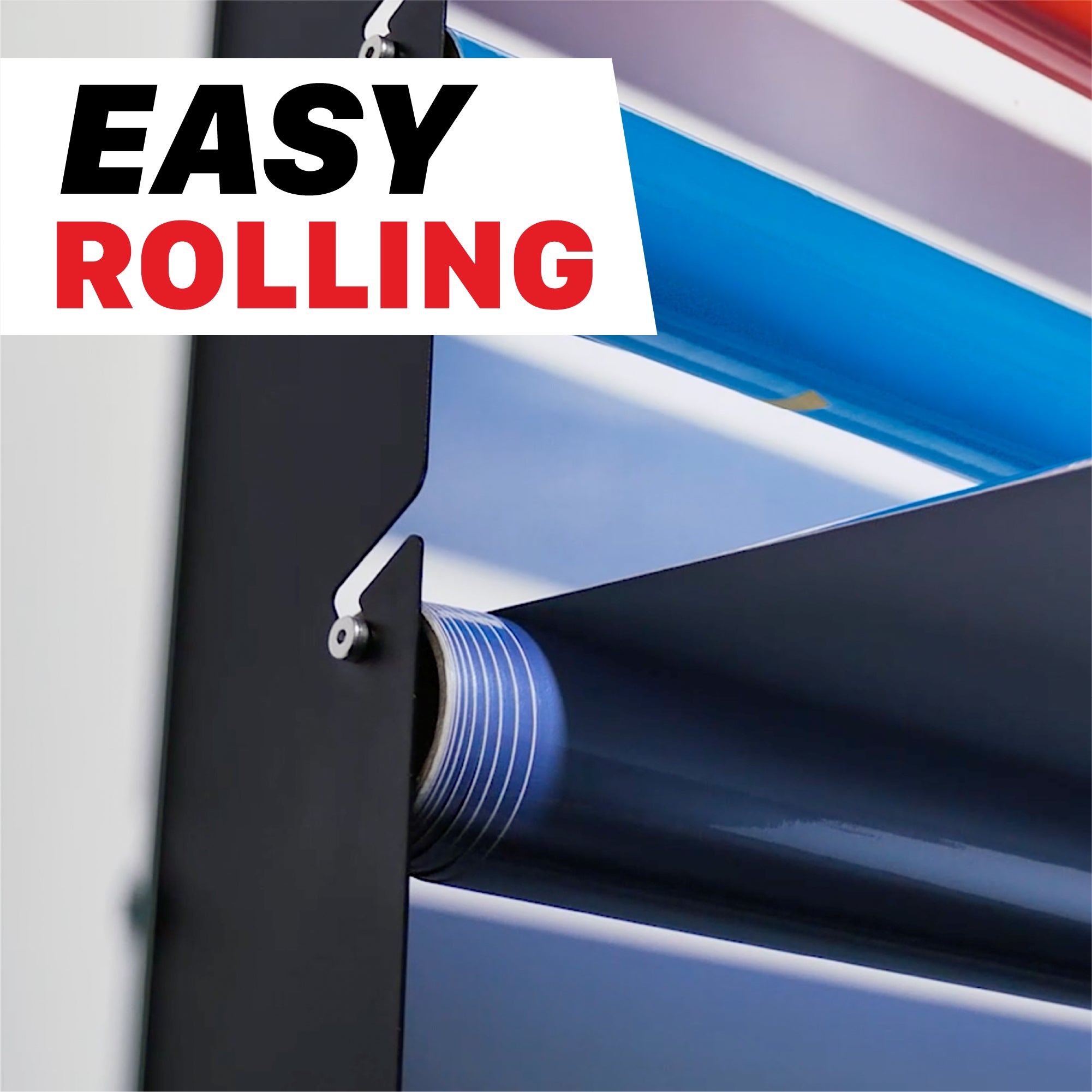 Close-up of a black roll of PPF or vinyl being unrolled from a mounting frame, with a white overlay in the top left reading 'EASY ROLLING' in black and red text. H20 Wall Mounted Film Hanger - PPF and Vinyl 5 Roll Holder