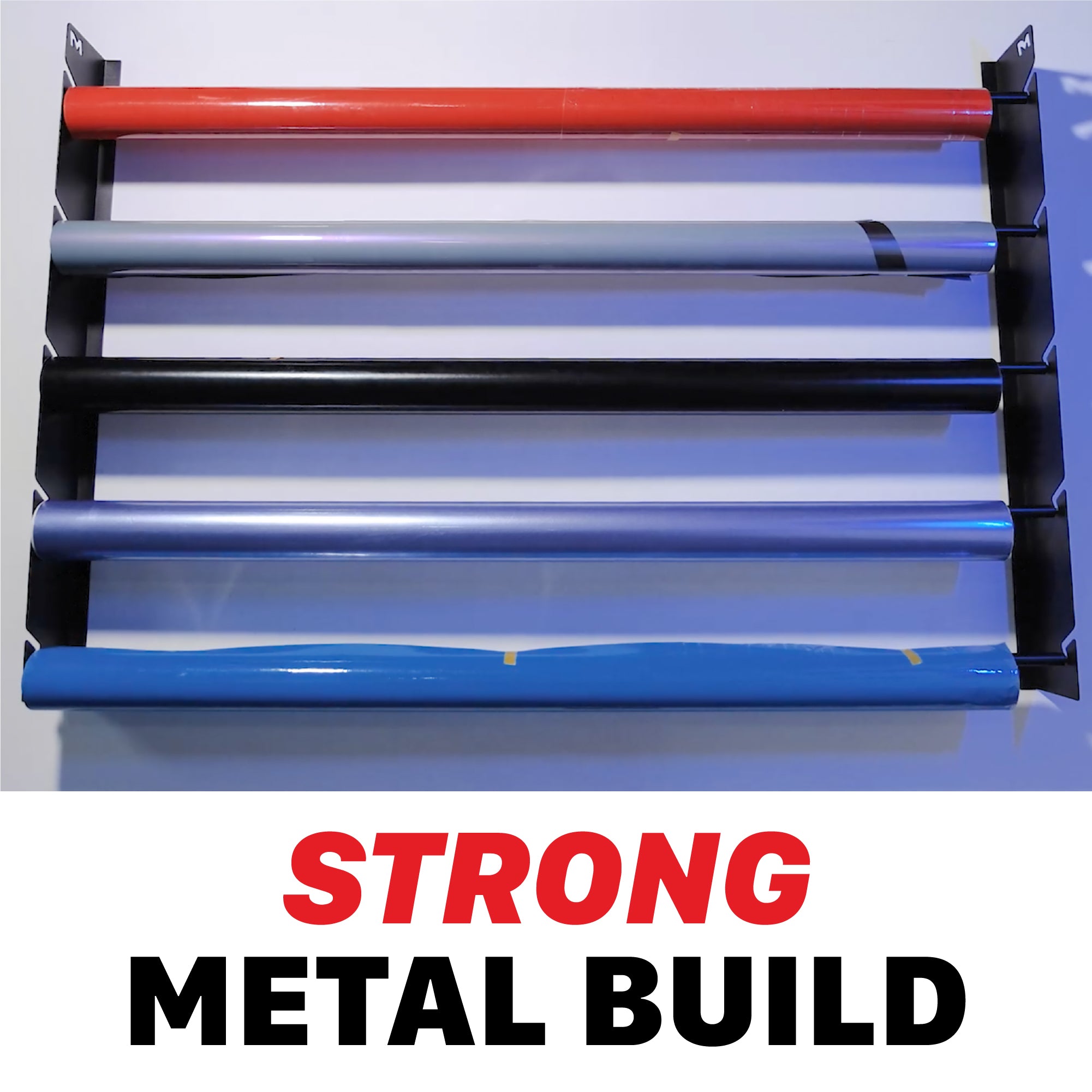 A set of five PPF or vinyl rolls mounted horizontally on a black metal rack, shown against a white background with a large text overlay at the bottom reading 'STRONG METAL BUILD' in red and black. H20 Wall Mounted Film Hanger - PPF and Vinyl 5 Roll Holder