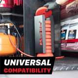 A black MaxShine polishing pads wall mount filled with red polishing pads, one being held by a gloved hand inside a mobile detailing van, with an orange air compressor on the left and product packaging on a red shelf in the background. A text overlay at the bottom reads 'UNIVERSAL COMPATIBILITY'. Polisher Pads Holders