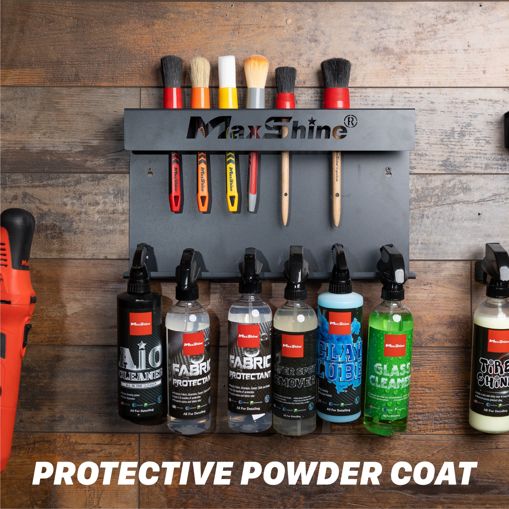 MaxShine brush holder mounted on a rustic wood wall, holding several cleaning brushes above and below a row of MaxShine spray bottles. Large text at the bottom reads PROTECTIVE POWDER COAT. H06 Wall Mount Tool Holder