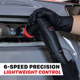 A person wearing black gloves uses a black handheld car polish machine on a gray car body near the headlight. Text at the bottom reads '6-SPEED PRECISION LIGHTWEIGHT CONTROL'. M0312 V2 Cordless Dual Action Polisher