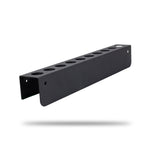 A black metal detailing brush wall mount with multiple circular cutouts, shown floating against a plain white background with a soft shadow underneath. H06A Car Detailing Brush Holder