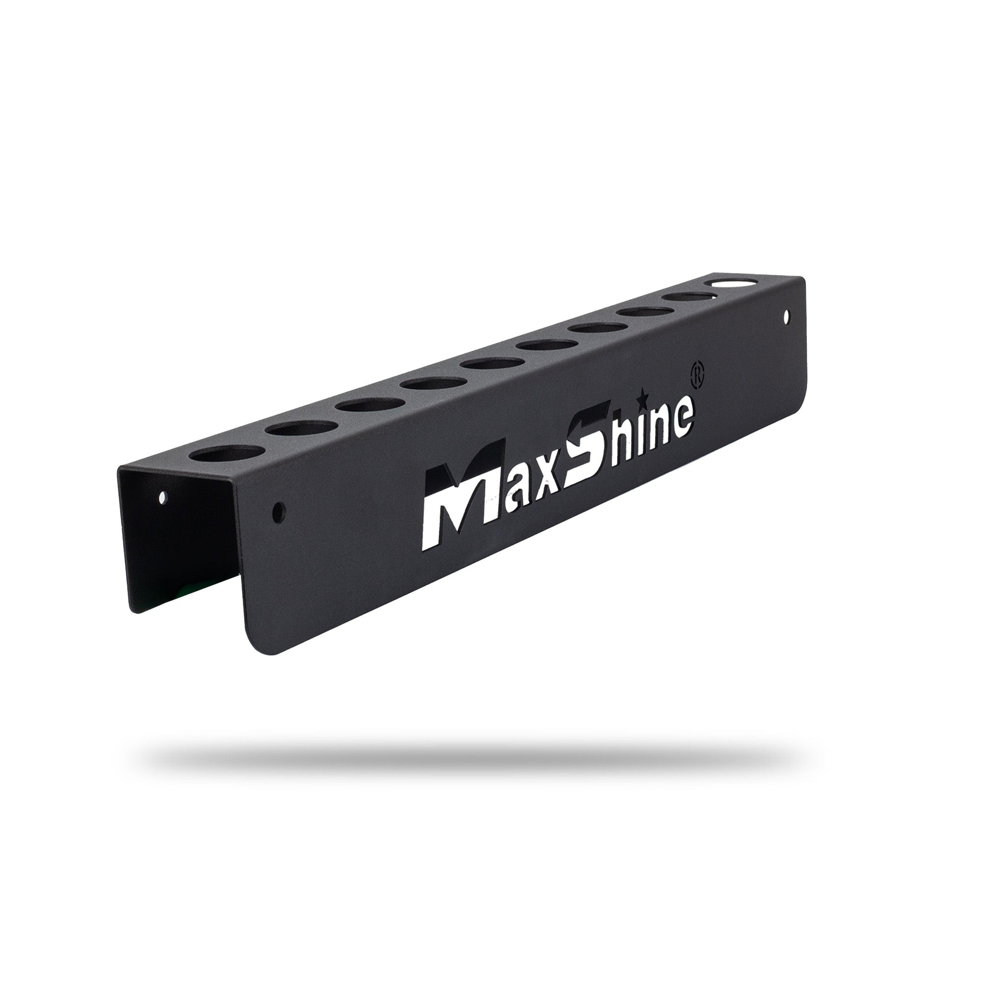 A black metal detailing brush wall mount with multiple circular cutouts and a prominent MaxShine logo, shown floating against a plain white background with a soft shadow underneath. H06AZ Car Detailing Brush Holder