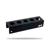 A black metal detailing brush wall mount with multiple circular cutouts and a prominent, shown floating against a plain white background with a soft shadow underneath. H06D Car Detailing Brush Holder