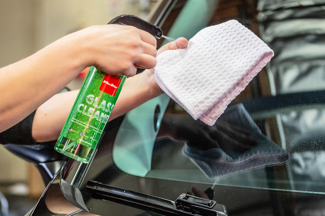 MaxShine Car Glass Cleaner spray onto waffle weave towel